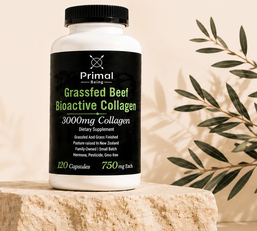 Grassfed Beef Bioactive Collagen bottle on a stone plinth beside olive branches