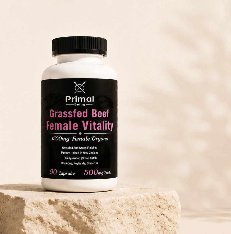 Primal Being Grassfed Beef Female Vitality bottle on a stone plinth